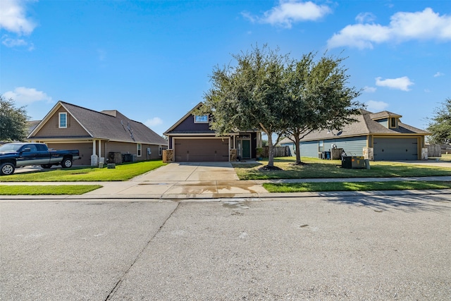 view of front of property featuring a garage and a front lawn