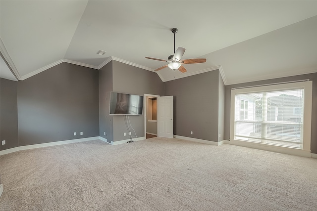 interior space with lofted ceiling, crown molding, ceiling fan, and light carpet