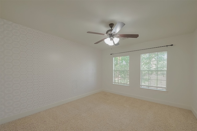 carpeted empty room with ceiling fan