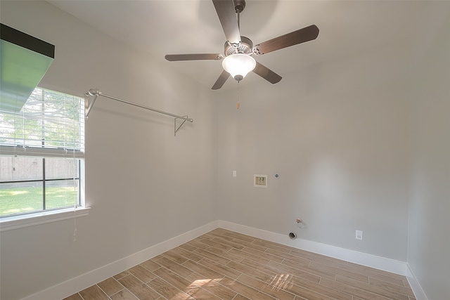 laundry room featuring ceiling fan, light wood-type flooring, and gas dryer hookup