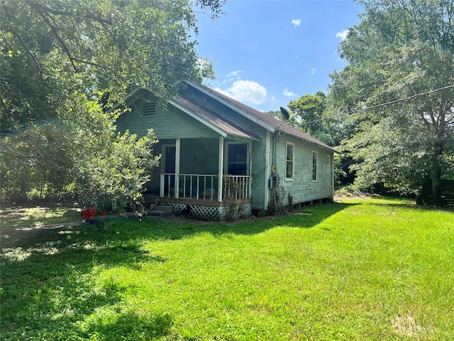 view of home's exterior with a yard