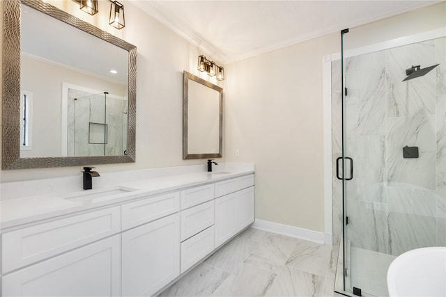 bathroom with vanity, crown molding, and a shower with shower door