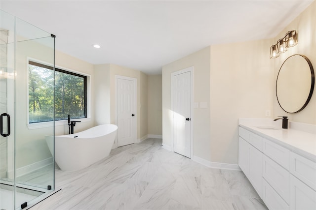 bathroom with vanity and independent shower and bath