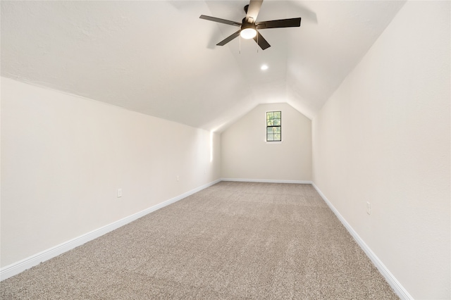 bonus room with ceiling fan, lofted ceiling, and light colored carpet