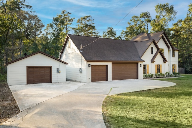 view of front facade with a front yard and a garage