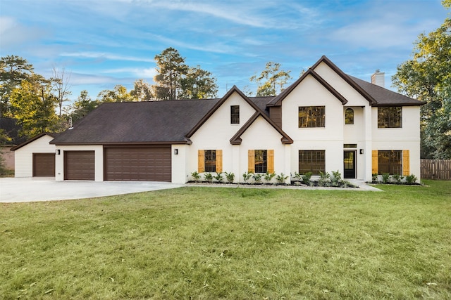 view of front facade with a front yard and a garage