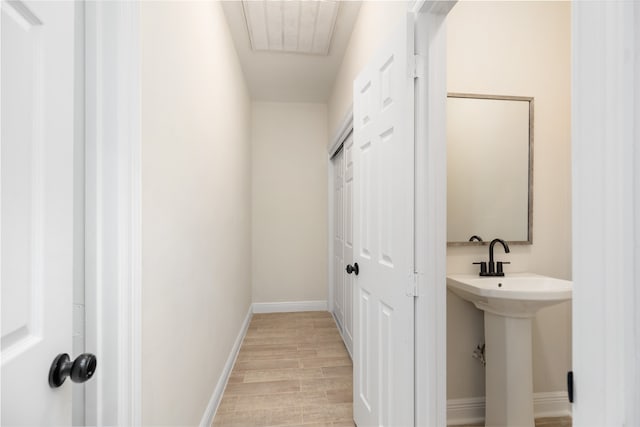 bathroom with wood-type flooring