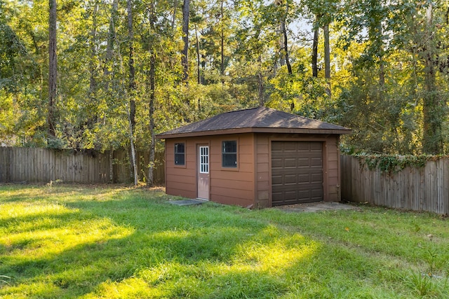 view of outbuilding with a yard