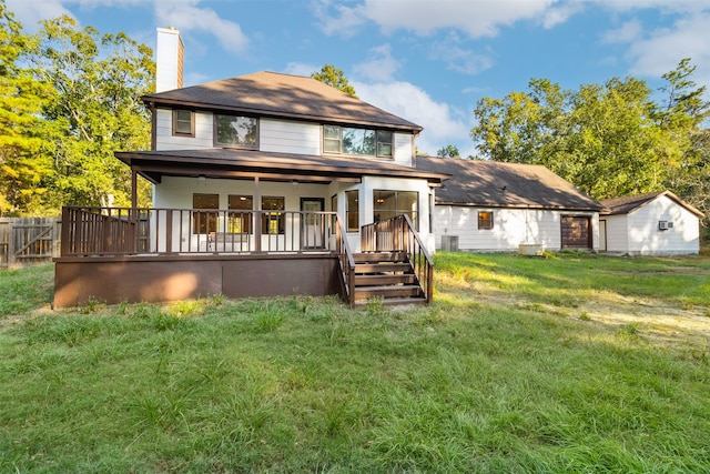 rear view of house with a lawn