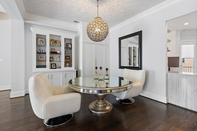 dining room featuring dark hardwood / wood-style floors and crown molding