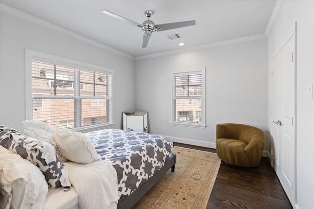 bedroom with ceiling fan, crown molding, and dark hardwood / wood-style flooring