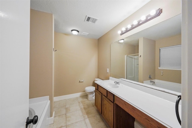 bathroom featuring vanity, a bathtub, tile patterned floors, and toilet