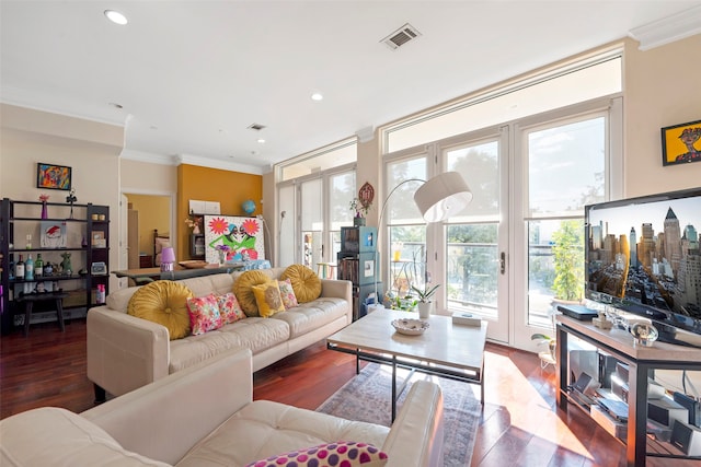 living room featuring dark hardwood / wood-style floors and ornamental molding