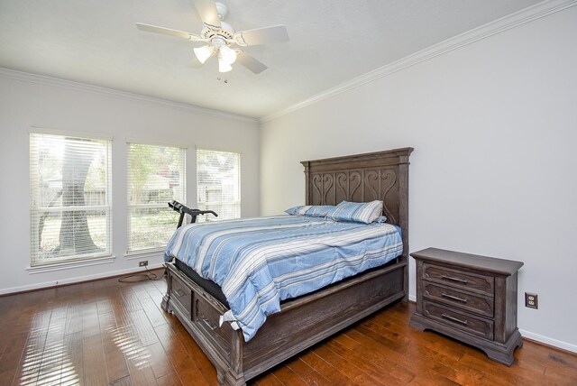 bedroom with crown molding, ceiling fan, and dark hardwood / wood-style flooring