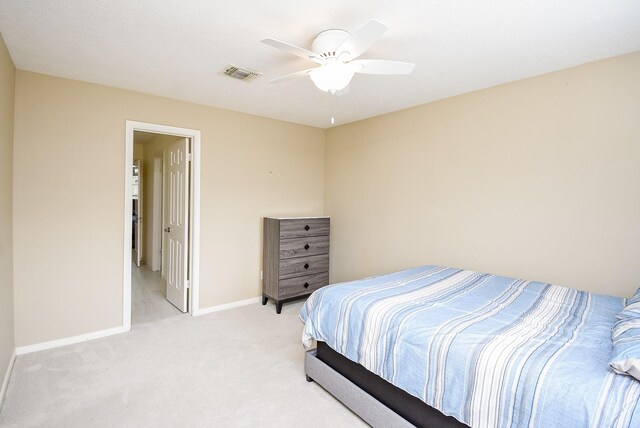 bedroom with light carpet and ceiling fan