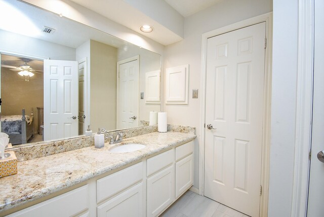 bathroom with vanity and ceiling fan