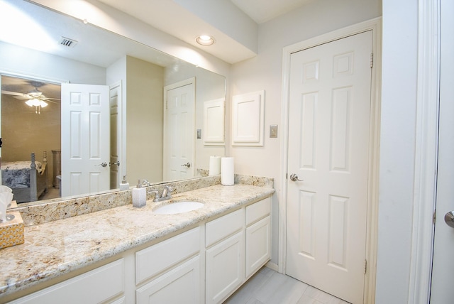 bathroom featuring ceiling fan, visible vents, and vanity