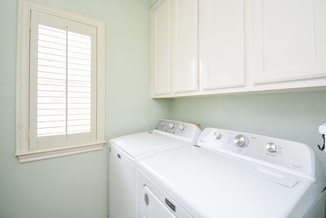 laundry room with cabinet space and washer and dryer