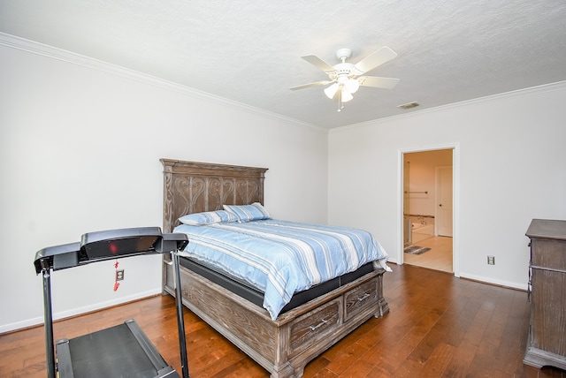 bedroom with a textured ceiling, ensuite bath, dark wood-type flooring, and ceiling fan