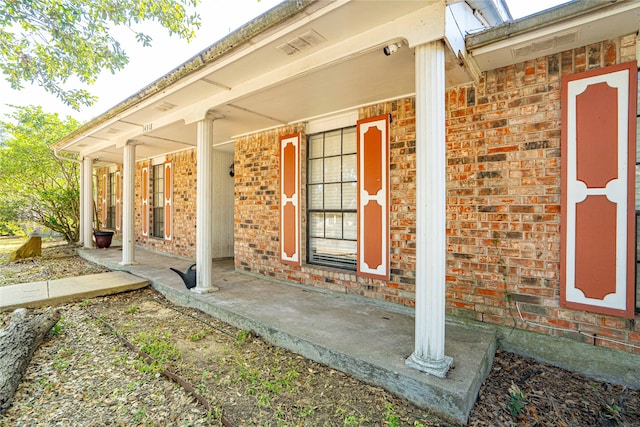 doorway to property with a porch