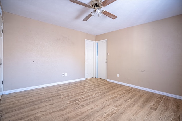 spare room with ceiling fan and light hardwood / wood-style flooring