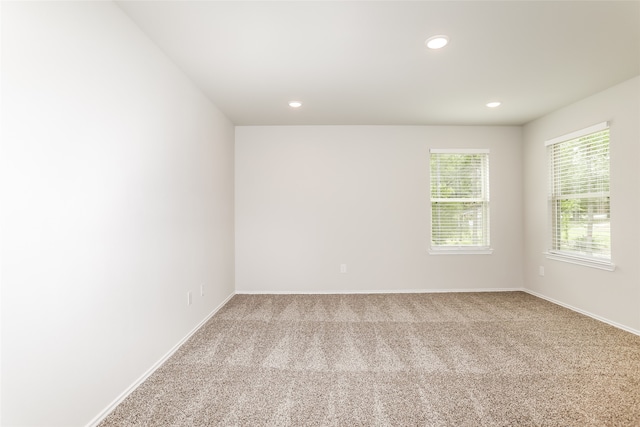 empty room with light colored carpet