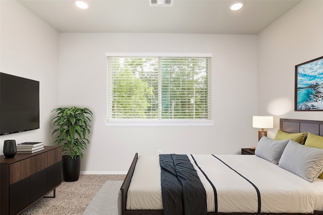 bedroom with light carpet