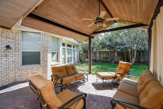 view of patio featuring ceiling fan and an outdoor living space