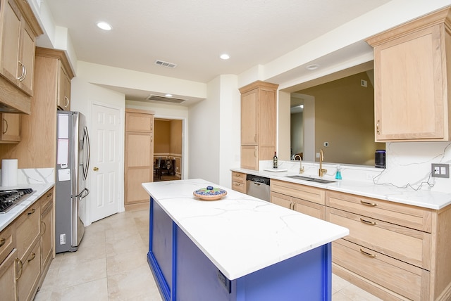 kitchen featuring kitchen peninsula, stainless steel appliances, sink, light brown cabinets, and light tile patterned flooring