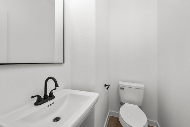 bathroom with sink and toilet