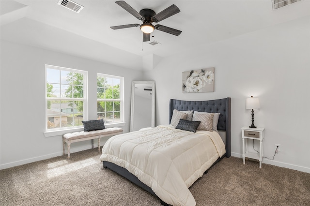 bedroom featuring dark colored carpet and ceiling fan