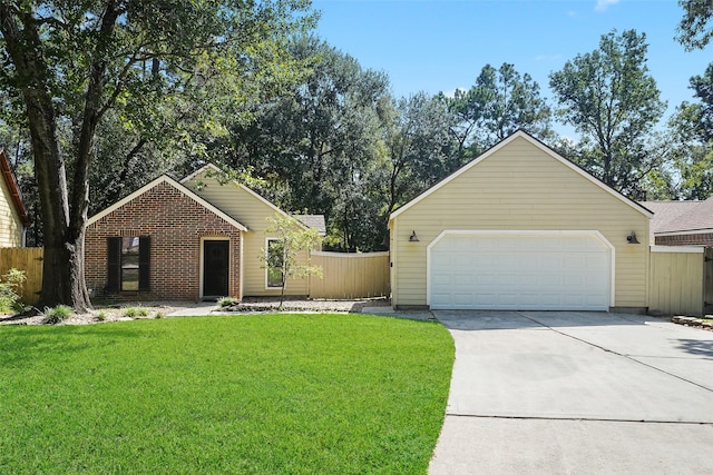 view of front of home featuring a garage and a front lawn