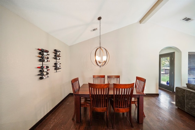 dining area with lofted ceiling with beams, dark wood-type flooring, and a chandelier