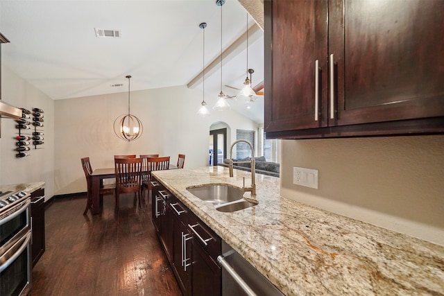 kitchen with lofted ceiling with beams, dark hardwood / wood-style flooring, stainless steel range oven, sink, and light stone countertops