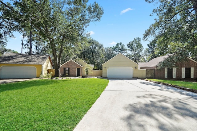 ranch-style home with a garage and a front lawn