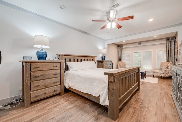 bedroom featuring ornamental molding, ceiling fan, and light hardwood / wood-style floors