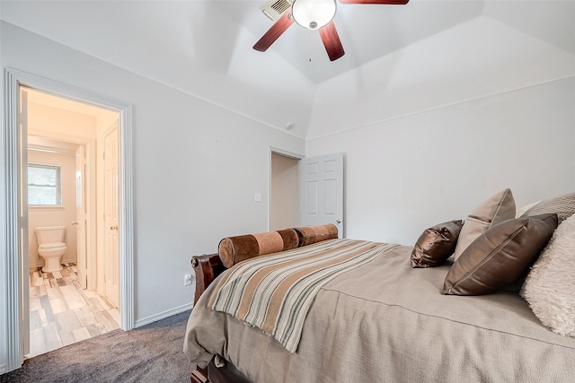 carpeted bedroom featuring lofted ceiling, ensuite bathroom, and ceiling fan