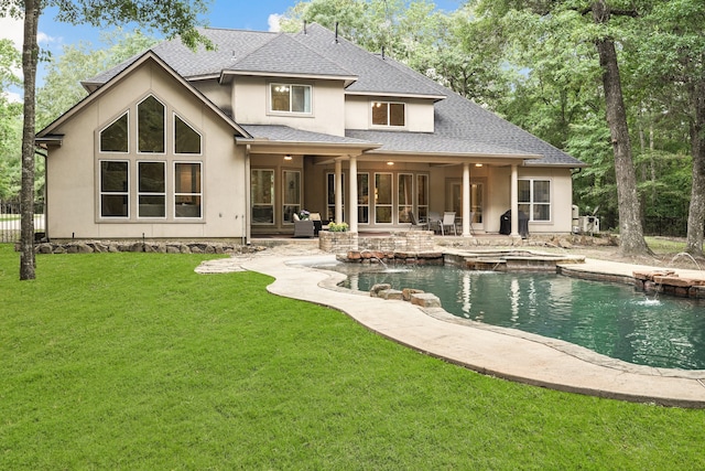 back of house featuring pool water feature, a patio, and a lawn