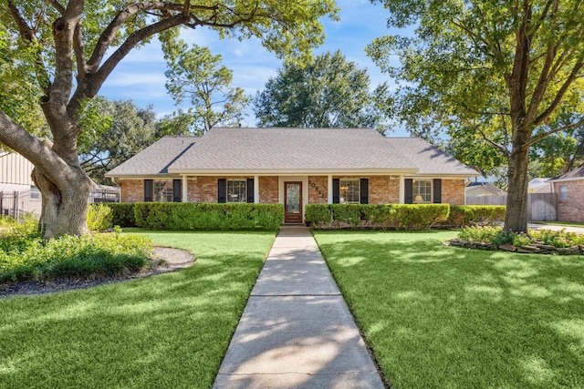 single story home featuring a front yard