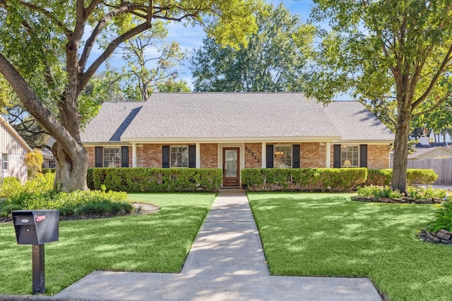 ranch-style house with a front yard