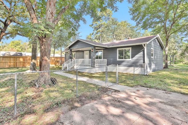 ranch-style home with a porch and a front yard