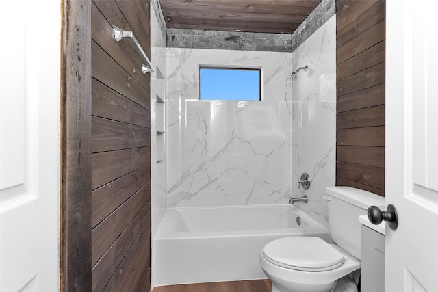 bathroom with wood-type flooring, toilet, wooden ceiling, and tiled shower / bath combo