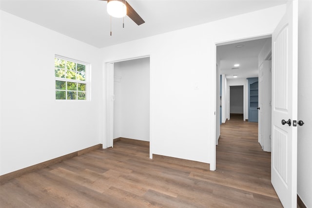 unfurnished room featuring wood-type flooring and ceiling fan