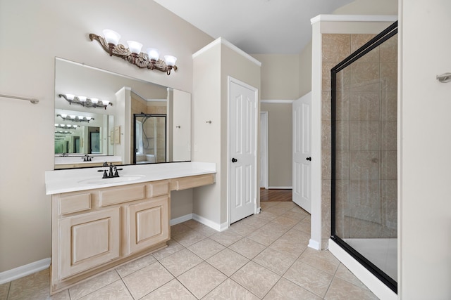 bathroom featuring an enclosed shower, tile patterned flooring, and vanity