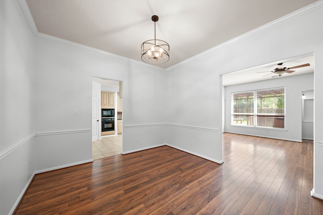 unfurnished room featuring ceiling fan with notable chandelier, hardwood / wood-style flooring, and ornamental molding