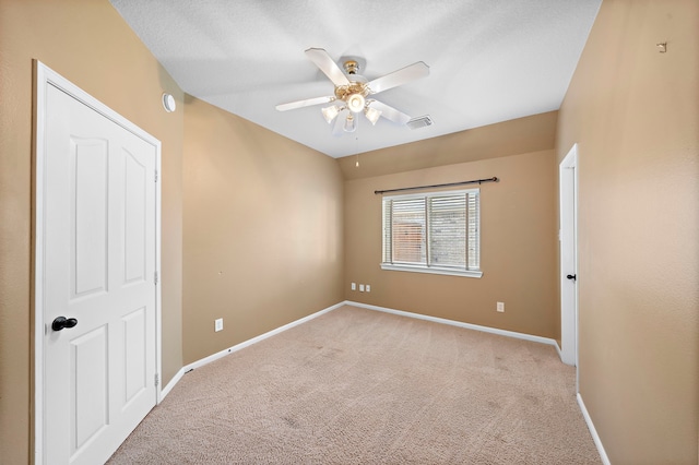 unfurnished bedroom with light carpet and ceiling fan