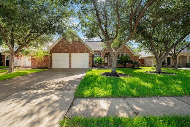 view of front of home featuring a garage and a front lawn