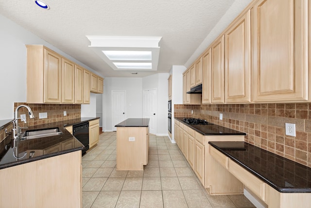 kitchen with black appliances, a center island, sink, light brown cabinetry, and backsplash