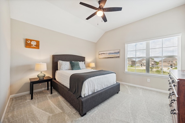 bedroom with light carpet, ceiling fan, and vaulted ceiling