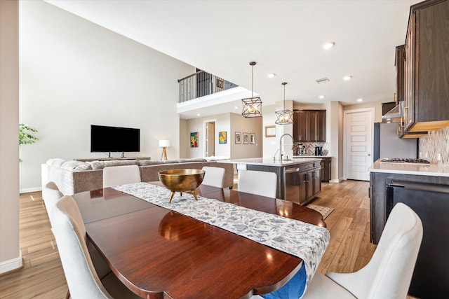 dining room featuring light hardwood / wood-style flooring and sink